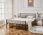 Black metal bed frame in a bedroom with wooden flooring and decorative elements.