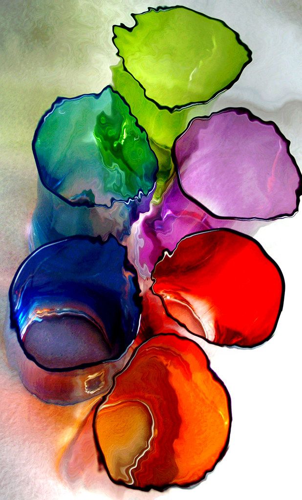 Colorful glass pieces in various shapes on a white background