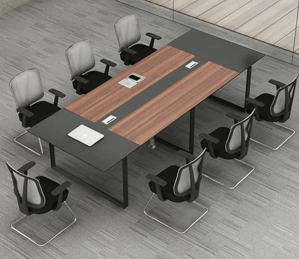 Modern office setup with a large conference table and chairs on a gray floor.