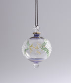 Decorative glass hanging ornament with floral design on a plain background