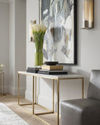 Modern interior with a console table, abstract painting, and decorative items.