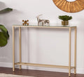 Console table with decorative items against a white wall