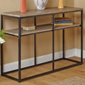 Console table with decorative items against a beige wall