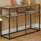Console table with decorative items against a beige wall