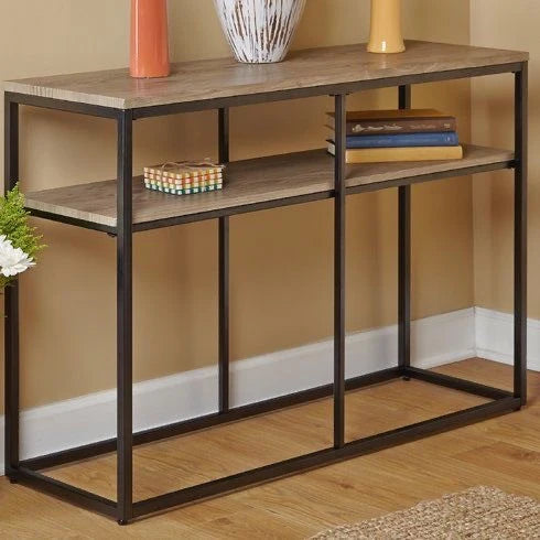 Console table with decorative items against a beige wall