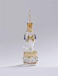 Glass smoking accessory with gold and white design on a gray background