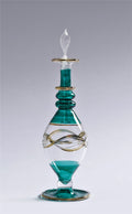 Decorative glass bottle with teal liquid on a gray background