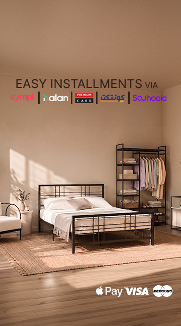 A modern bedroom scene showing a black metal bed frame with white bedding, a matching black metal shelving unit, and a beige rug on a wood floor. Text at the top reads 'EASY INSTALLMENTS VIA' with payment logos, and 'Pay VISA' and 'Mastercard' appear at the bottom right.