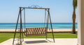 Swing set with a beach view in the background