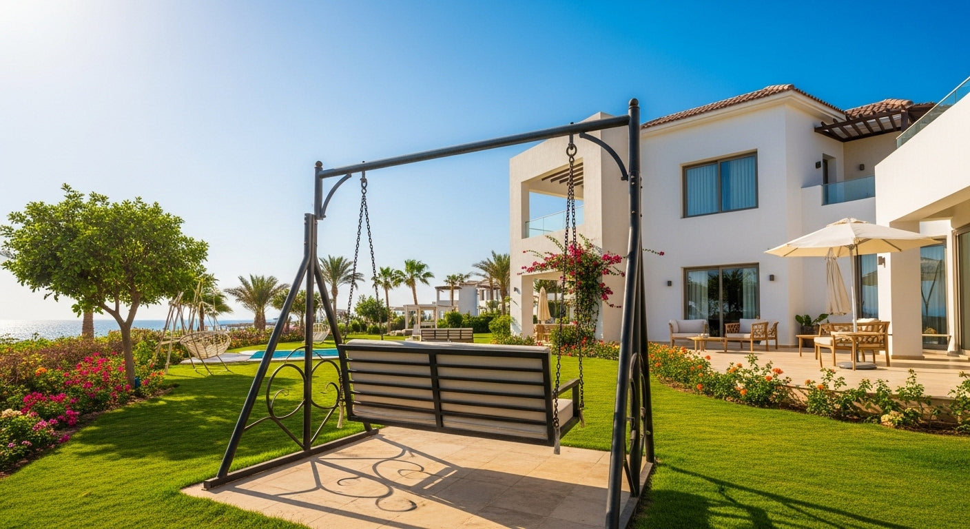 Swing set in a garden with a modern house in the background
