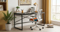 Modern office desk with chair, plants, and decor in a bright room.