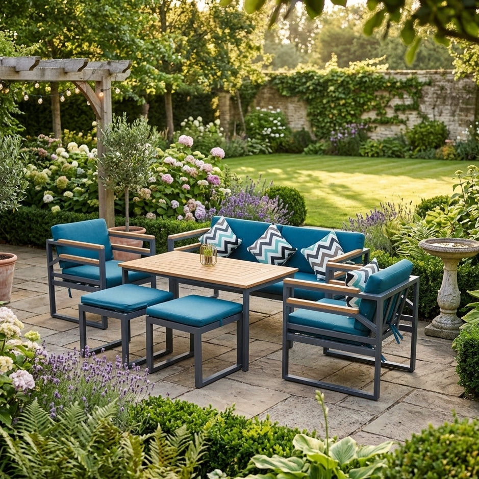 Outdoor patio set with blue cushions in a garden setting