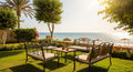 Outdoor patio set on a grassy area with ocean view