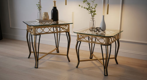 Two glass tables with decorative items on a wooden floor.